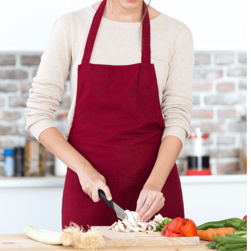 A girl in a burgundy color apron